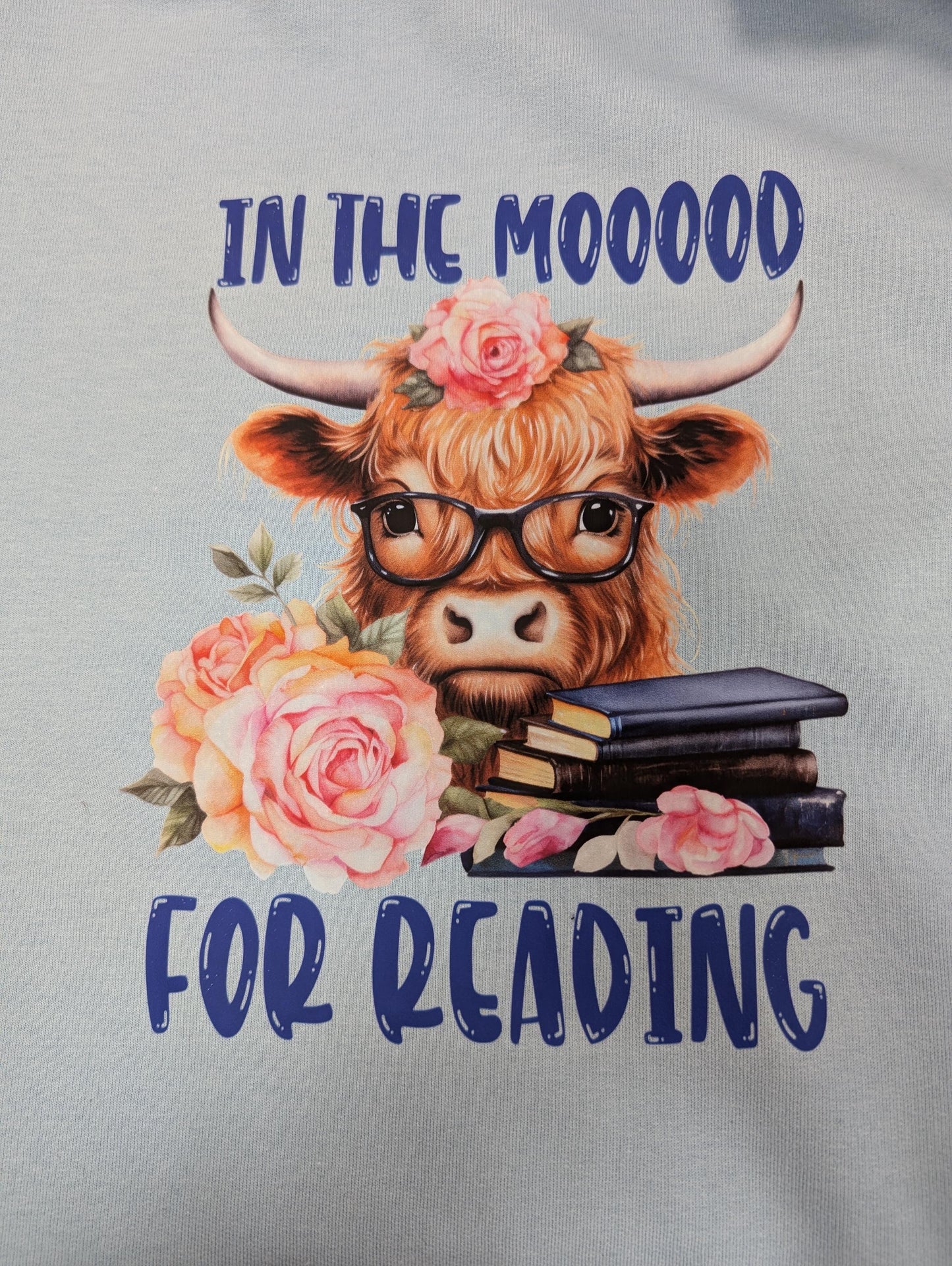In the Mooood For Reading sweatshirt, Reading Highland Cow, unisex blue top