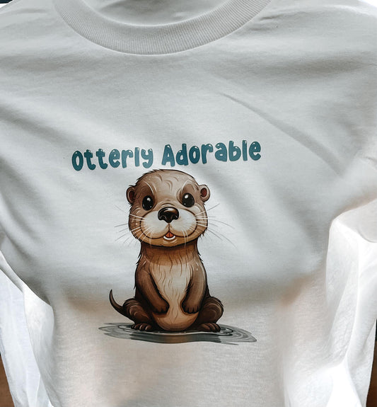 Otterly Adorable long-sleeve tshirt in white, graphic tee
