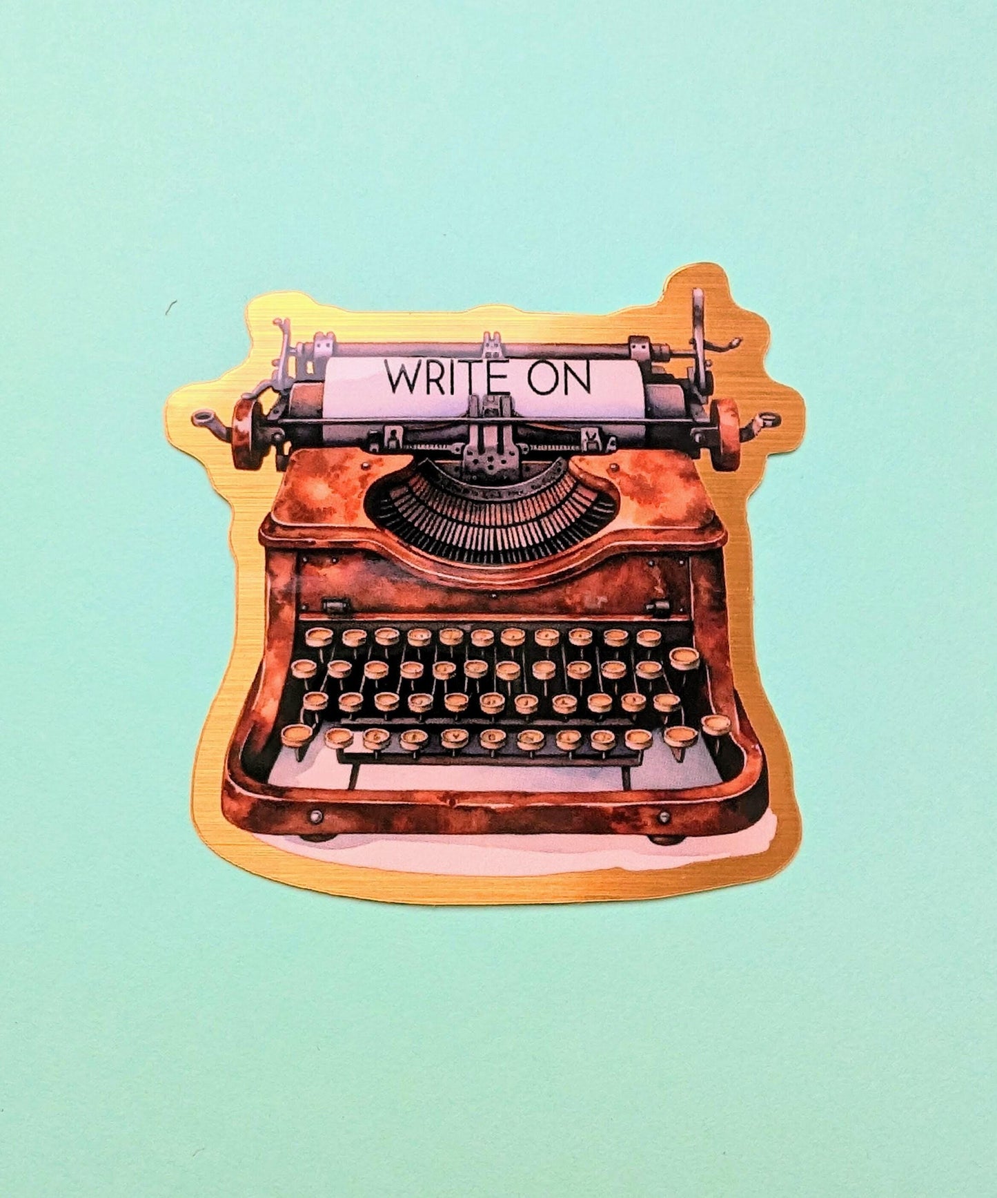 Write On Typewriter brushed gold die cut vinyl sticker