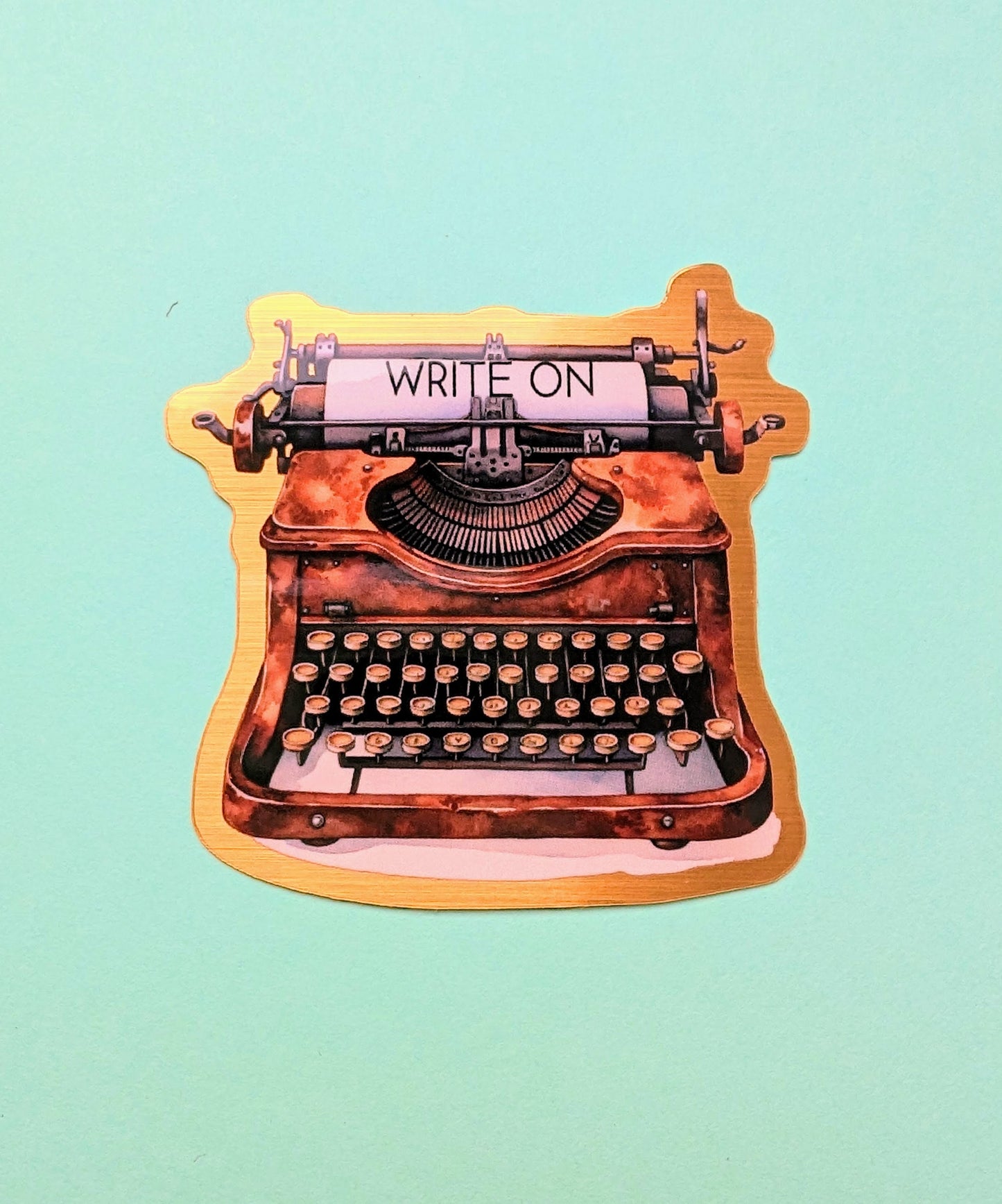 Write On Typewriter brushed gold die cut vinyl sticker